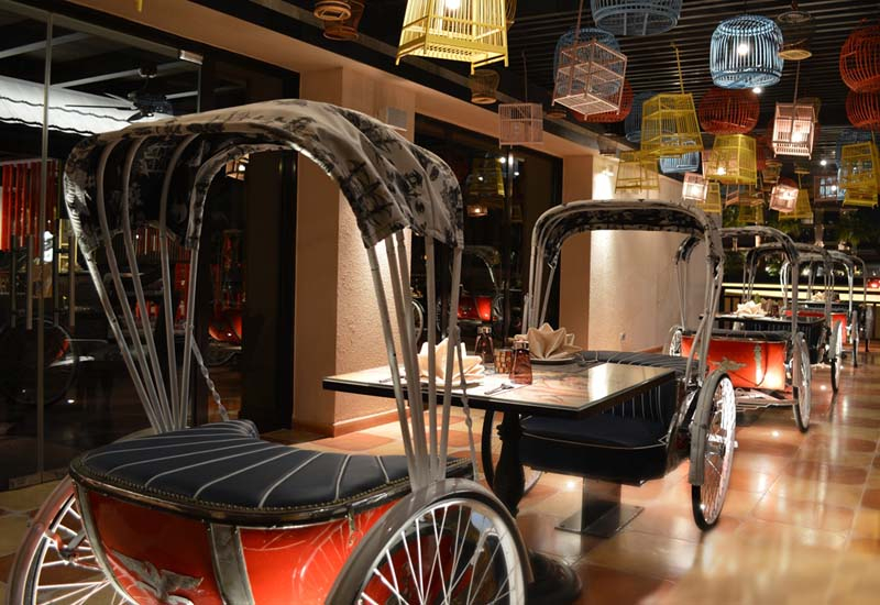 Rickshaws and hanging bird cages are some of the interior elements of Mekong. Rickshaws and hanging bird cages are some of the interior elements of Mekong.