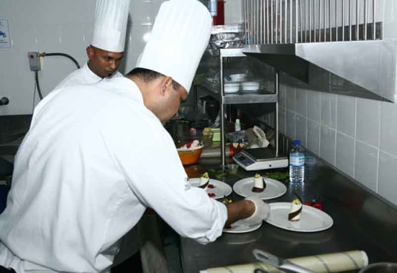 The Hilton team adds the finishing touches to a dish. The Hilton team adds the finishing touches to a dish.