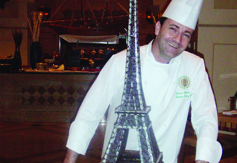 Laurent Allereau with his chocolate model of the Eiffel Tower Laurent Allereau with his chocolate model of the Eiffel Tower