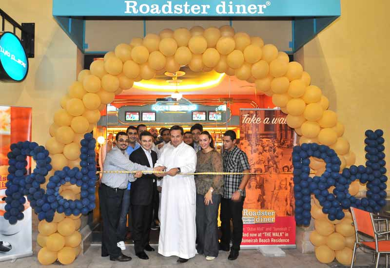 Cravia chief executive officer Walid Hajj cuts the ribbon at the latest Roadster diner to open in Dubai. Cravia chief executive officer Walid Hajj cuts the ribbon at the latest Roadster diner to open in Dubai.